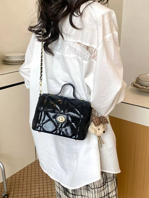 Black crossbody bag with turn-lock and quilted