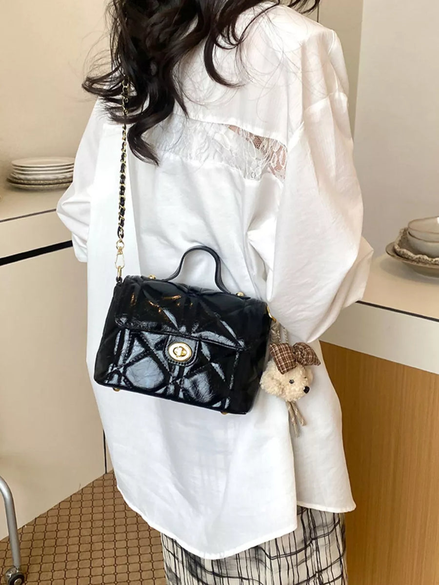 Black crossbody bag with turn-lock and quilted