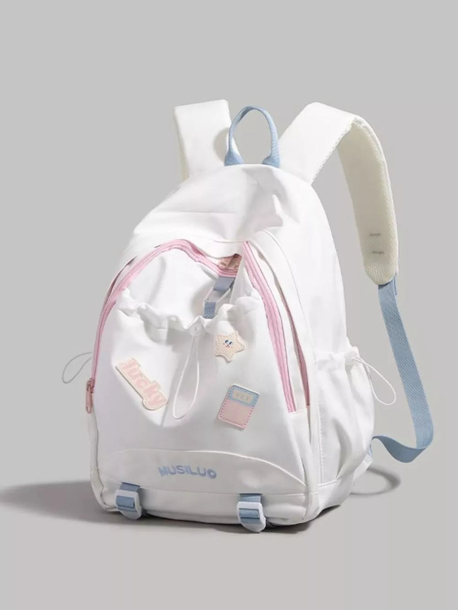 White drawstring backpack with pink accents and cute patches, adjustable blue straps