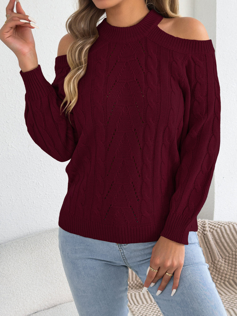 orange pullover sweater featuring cable-knit and cable knit