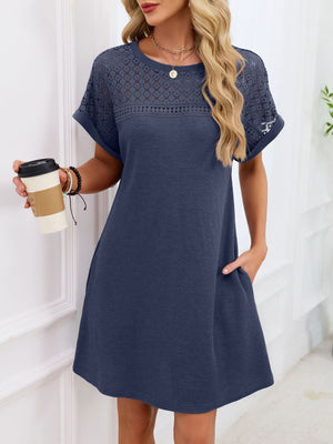 Sheer lace yoke t-shirt dress in dark blue with short sleeves and pockets.