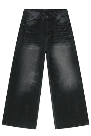 Oversized dark wash denim palazzo trousers with a washed finish and wide leg.