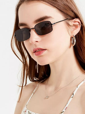 sunglasses in black featuring UV400 protection and rectangular fit