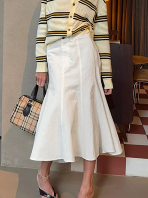 midi skirt in white featuring high-waisted and flared fit