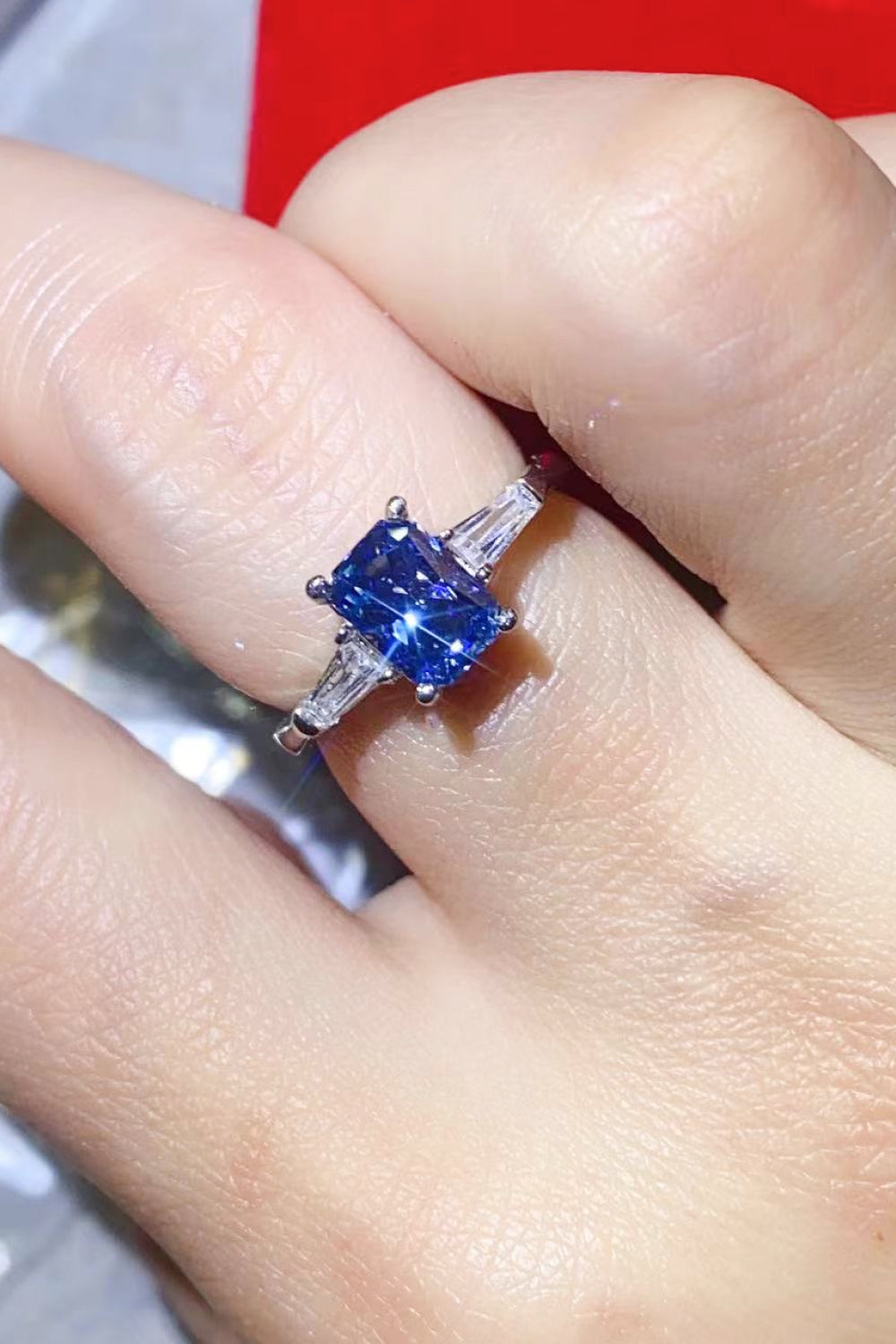 Blue sapphire prism moissanite ring in 925 sterling silver with baguette side stones