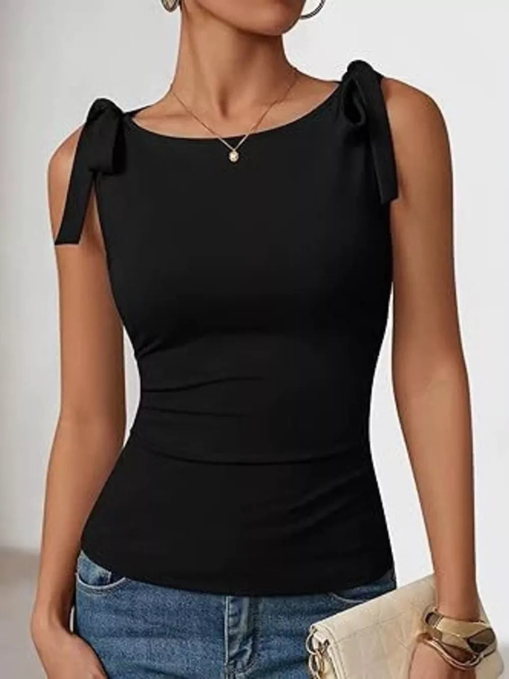 Black bow-tied shoulder tank top with boat neckline and slim fit.
