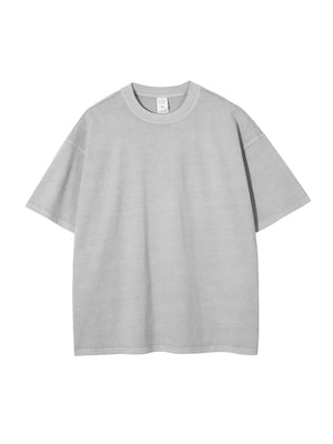 Oversized washed cotton tee in light gray with relaxed fit and crewneck.