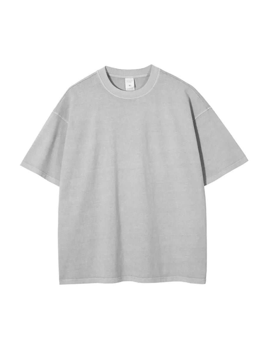 Oversized washed cotton tee in light gray with relaxed fit and crewneck.
