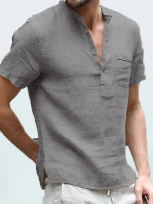 Gray linen henley shirt with short sleeves and a chest pocket.