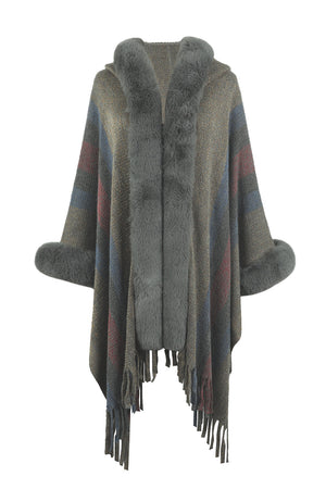 Textured stripe poncho with faux fur trim and fringe detail.