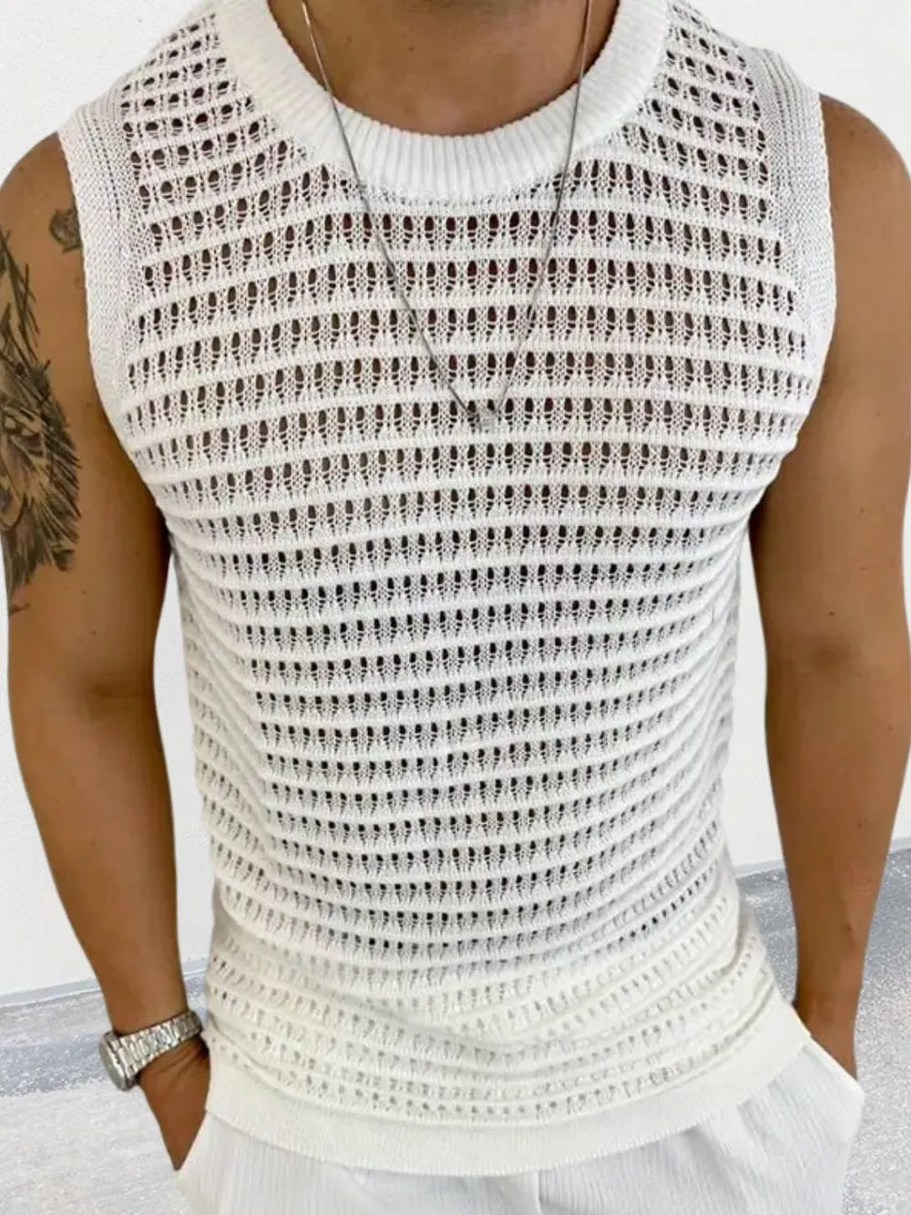 Ivory openwork knit tank top with crew neck and breathable acrylic blend.