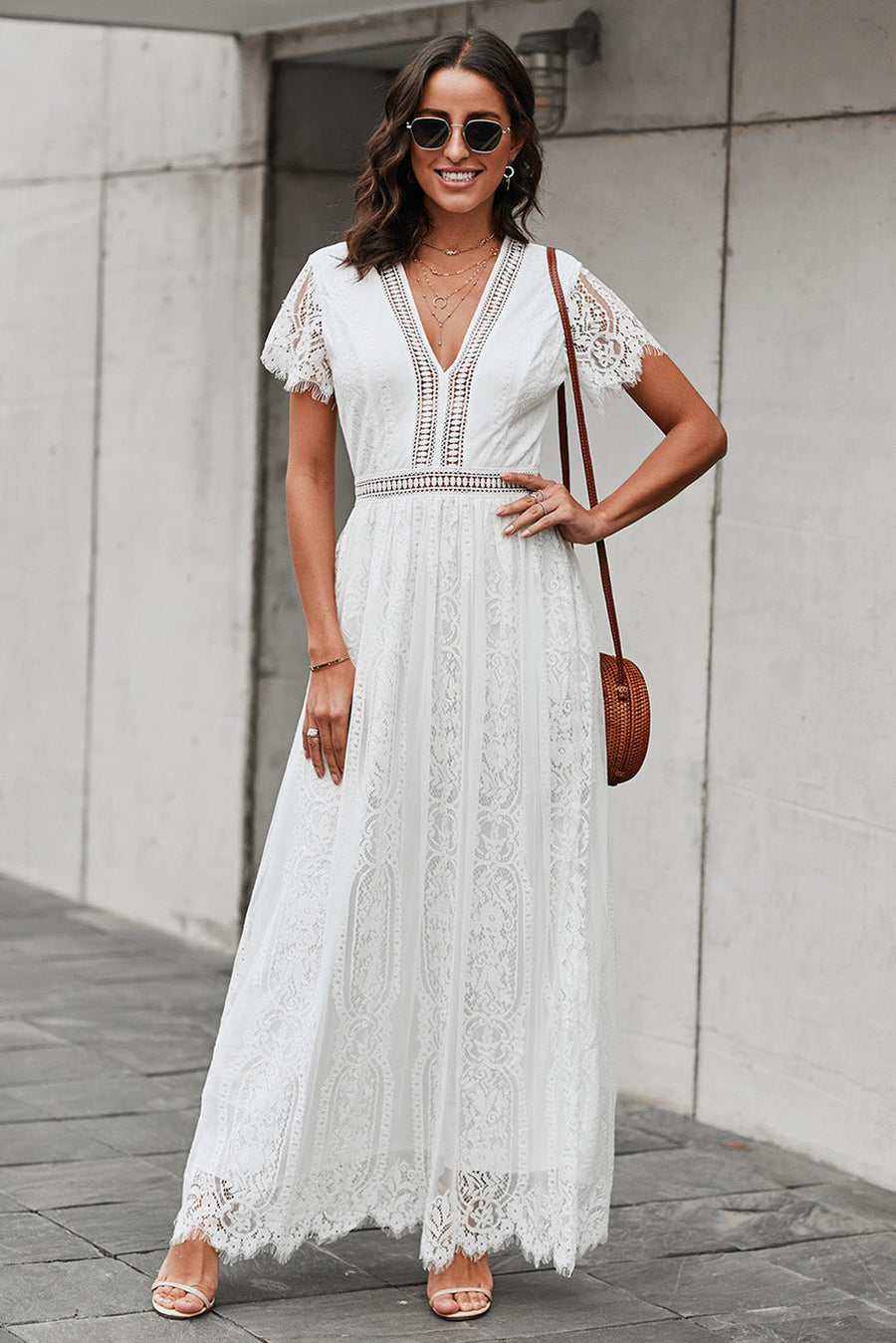 White lace midi dress with scalloped hem and short sleeves.
