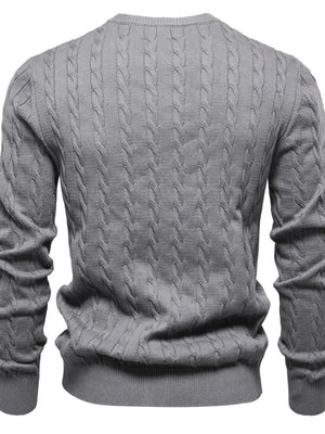 Gray cable knit crewneck sweater with ribbed cuffs and hem