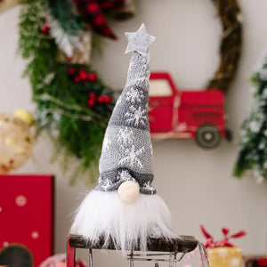 Illuminated knit gnome with gray snowflake pattern hat and white faux fur beard.