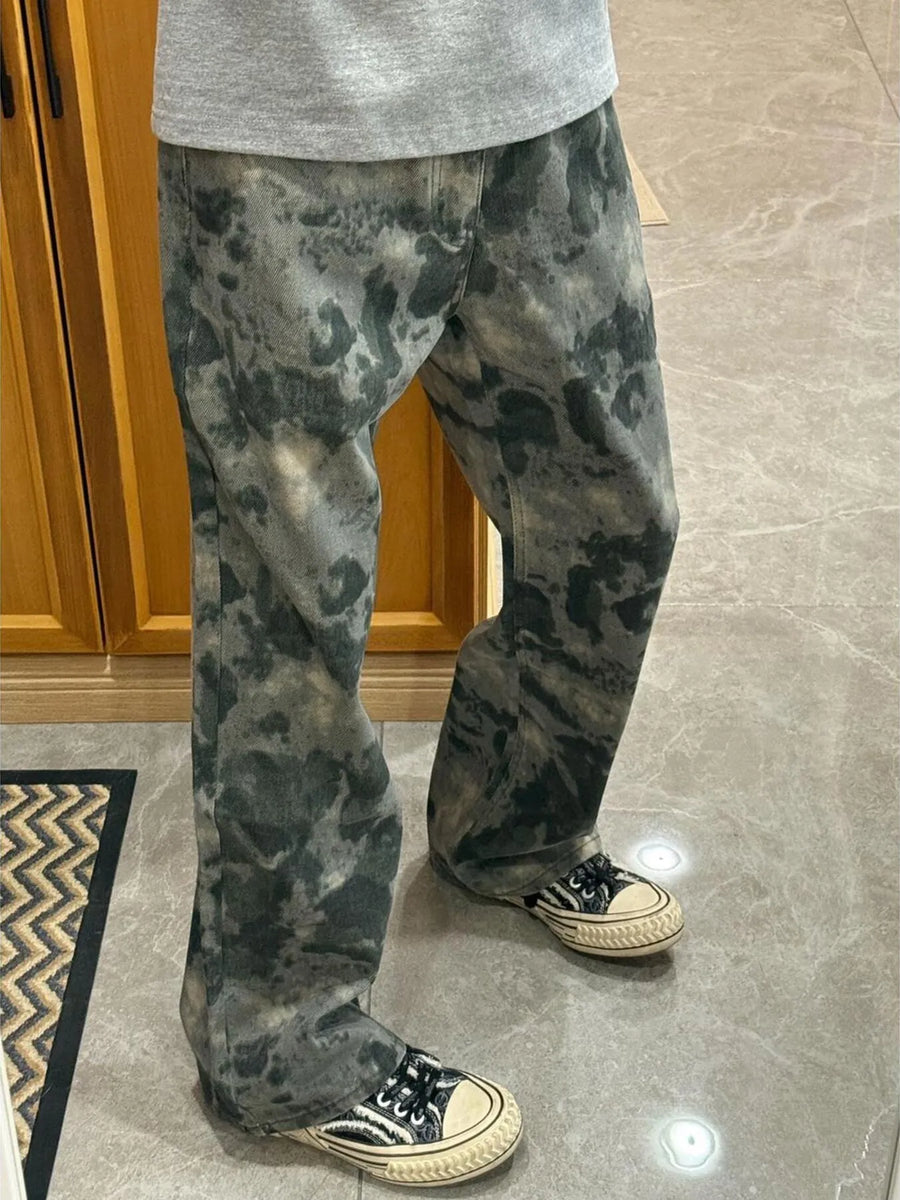 Men's loose fit cargo pants in moss green camouflage pattern.