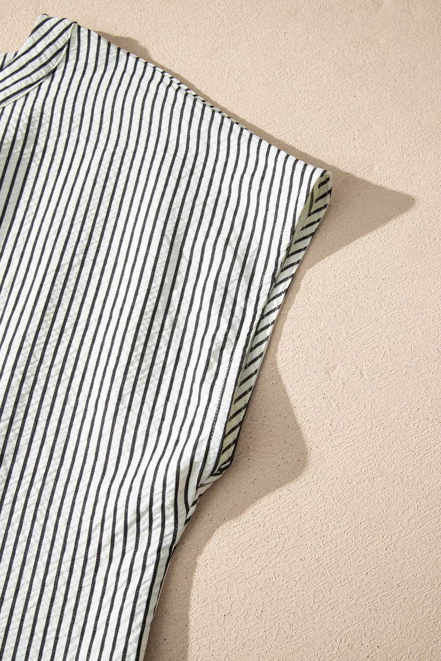 Chic striped ruffle maxi dress with cap sleeves and button-down detail.
