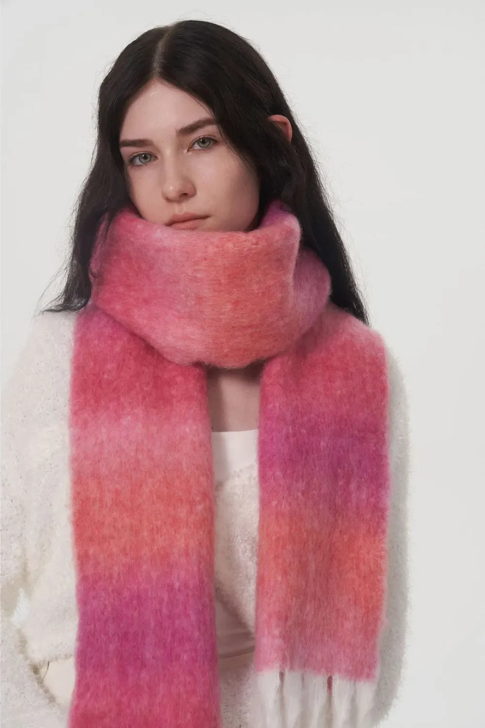 Gradient mohair scarf in hot pink and coral ombre with fringe detail.