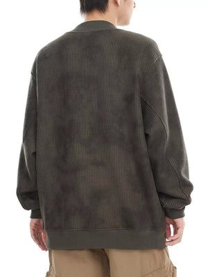 Oversized dark gray corduroy sweatshirt with a tie-dye effect and ribbed crew neck.