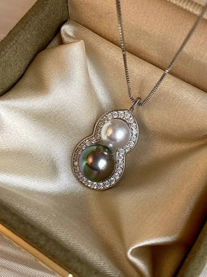 Silver necklace with gourd pendant featuring pearls and crystal accents
