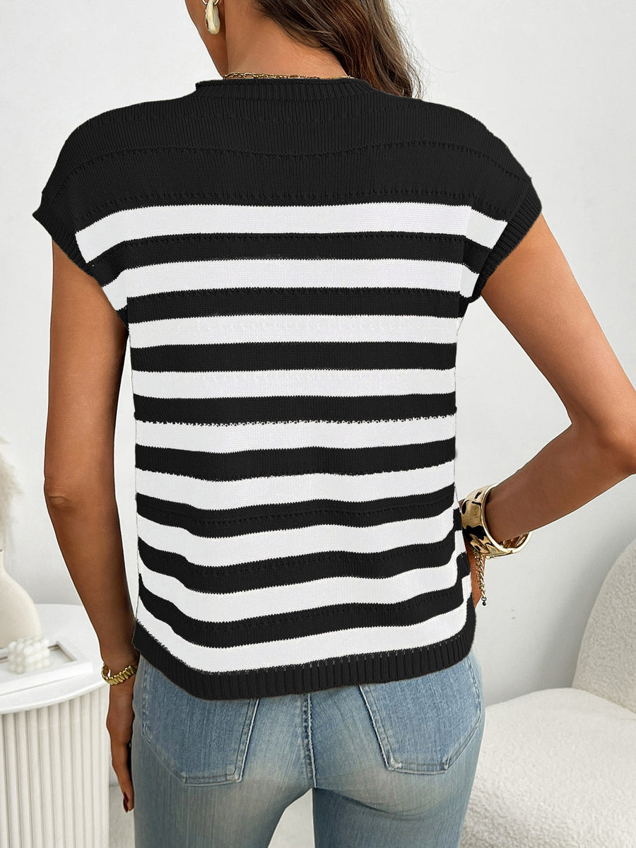 Black and white striped knit sweater with short sleeves and a mock neck.