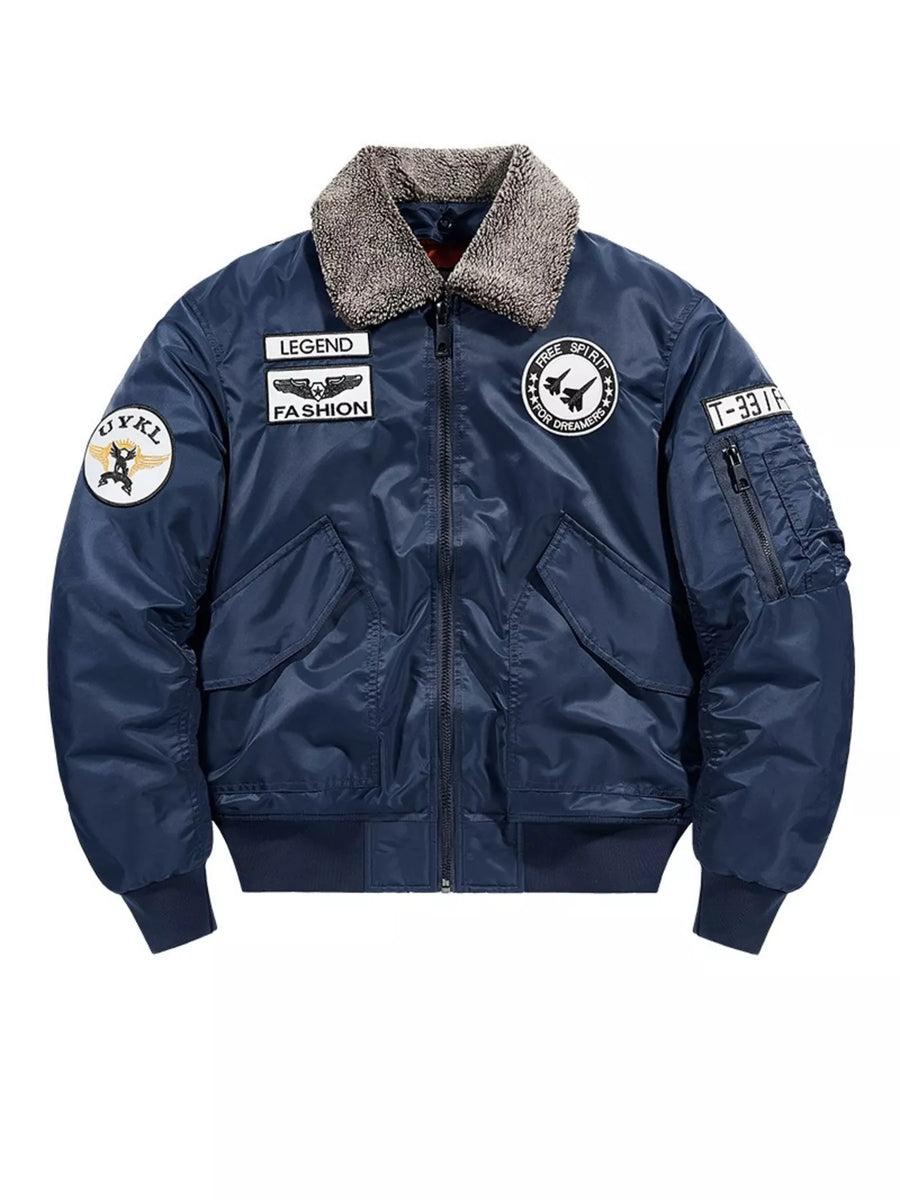 Dark blue bomber jacket with embroidered patches and faux fur collar.