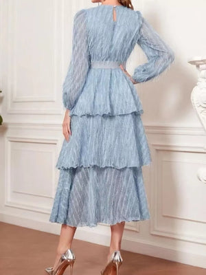 Sky blue tiered midi dress with balloon sleeves and defined waist.