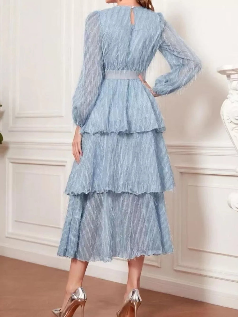 Sky blue tiered midi dress with balloon sleeves and defined waist.