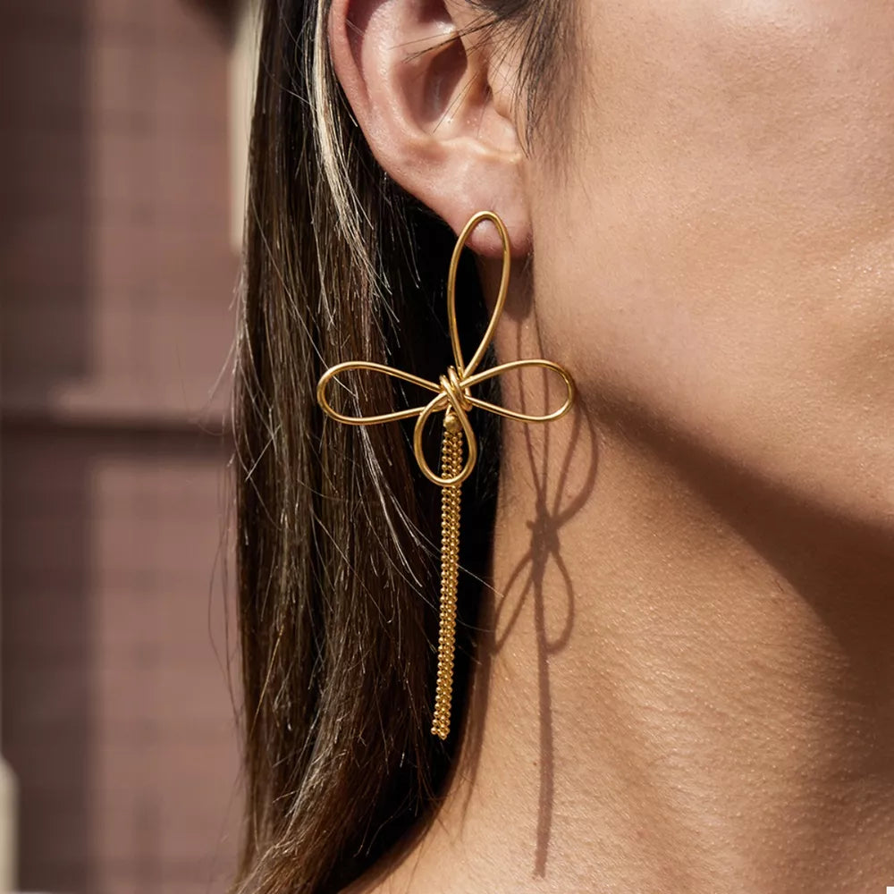 earrings in gold featuring tassel and dangle fit