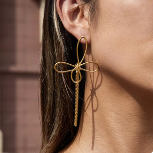 earrings in gold featuring tassel and dangle fit