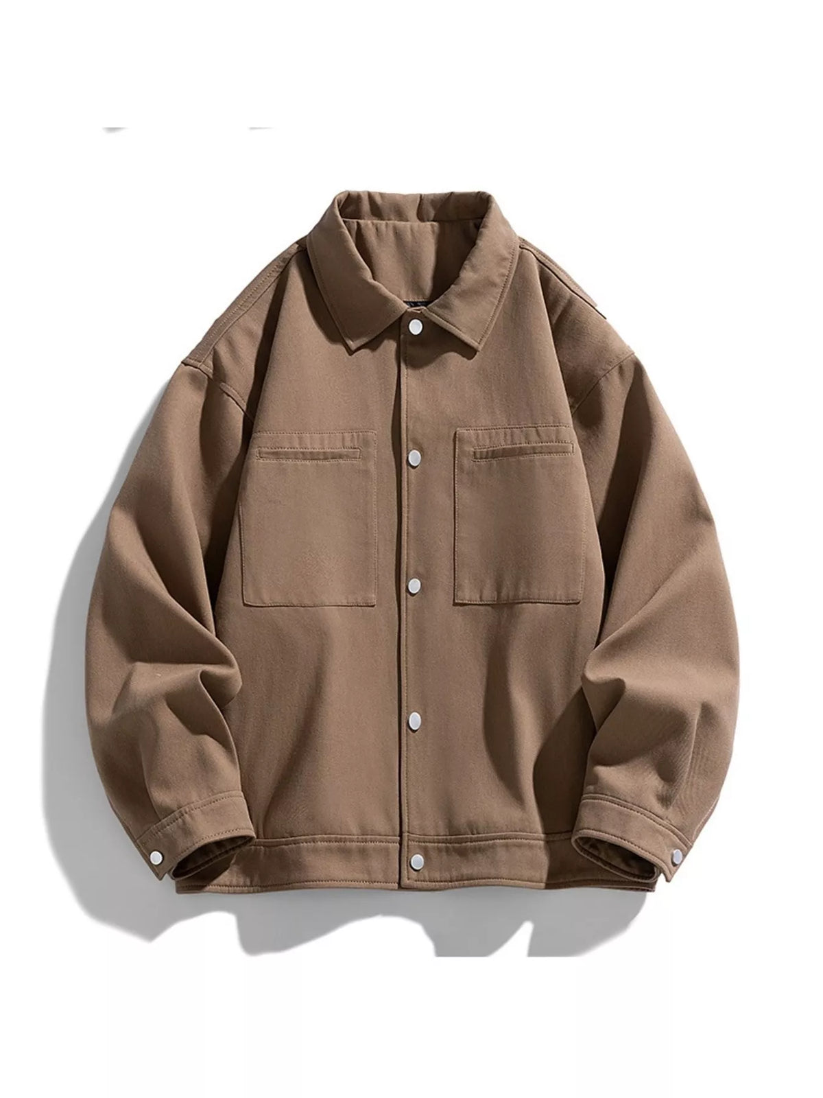 Oversized casual jacket in camel brown with snap buttons and chest pockets.