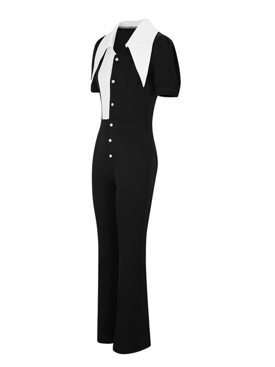 Black and white button-down wide leg jumpsuit with a pointed collar and short sleeves.