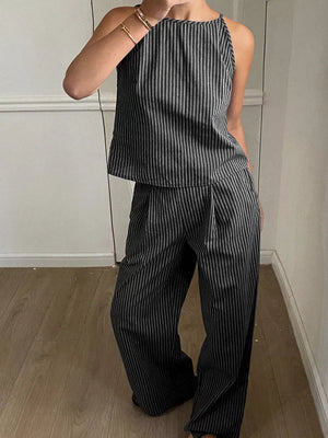 Black striped sleeveless top and wide-leg pants set with a halter neckline.