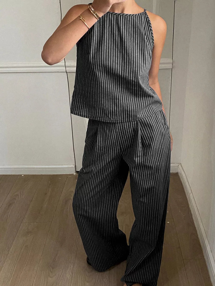 Black striped sleeveless top and wide-leg pants set with a halter neckline.