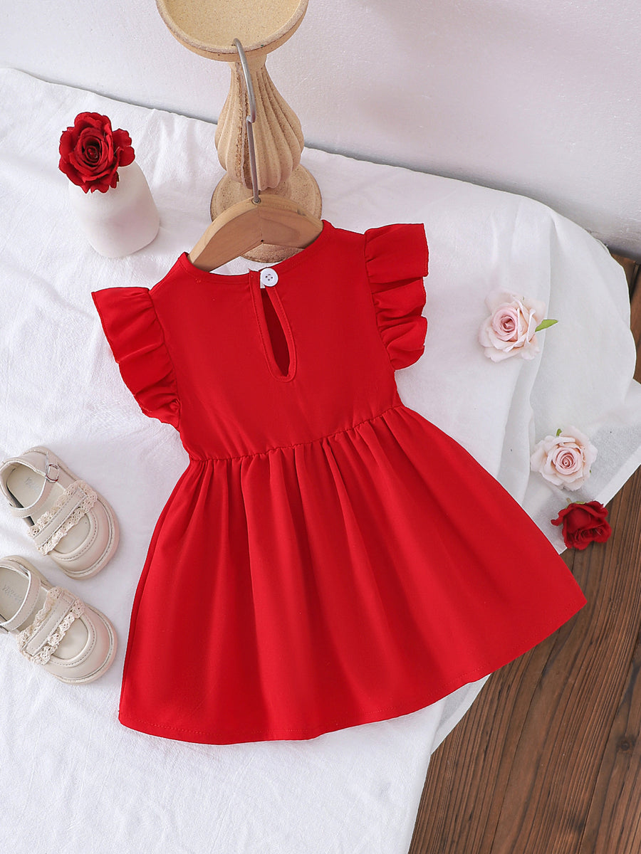 Red cotton baby dress with ruffle sleeves and flower appliqué detail.