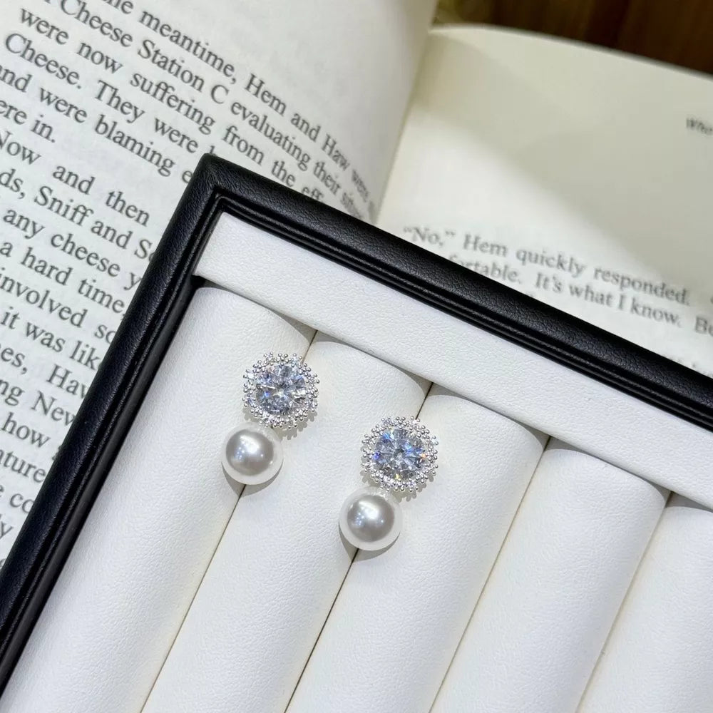 earrings in silver featuring zircon embellishment and drop fit