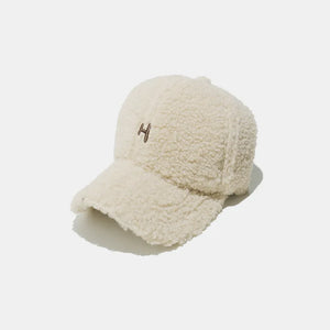 Ivory sherpa baseball cap with embroidered H detail