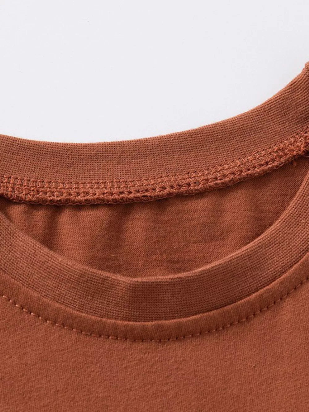 Brown cotton t-shirt with ruffle sleeves and zebra print detail.