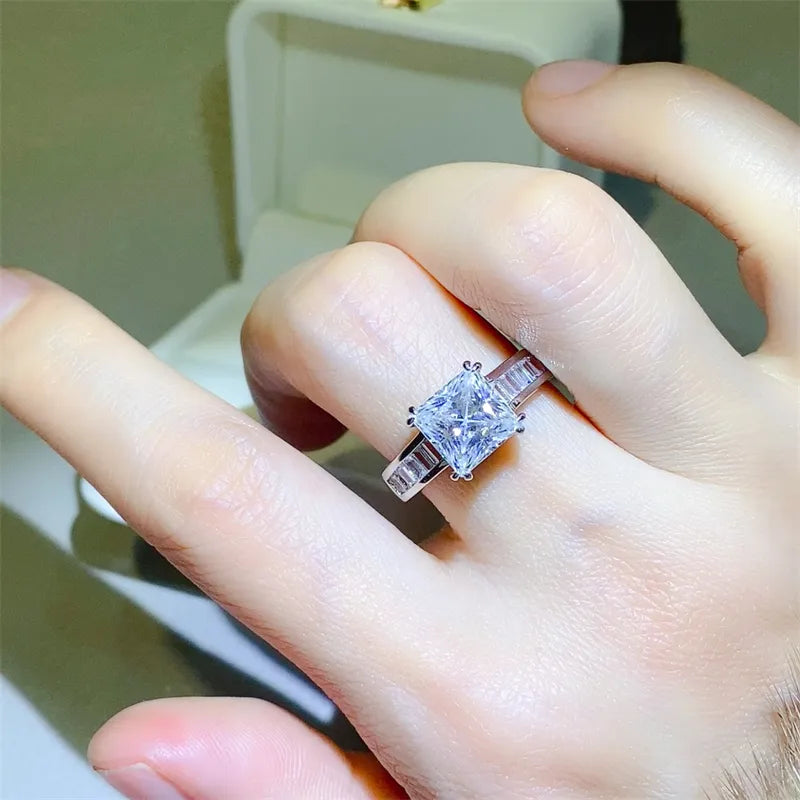 Silver princess cut engagement ring with baguette band