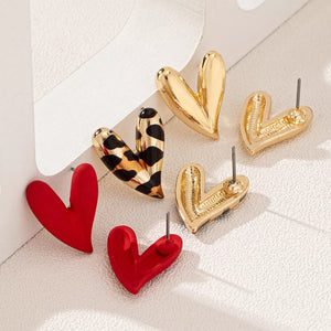red earrings featuring heart-shaped and leopard-print
