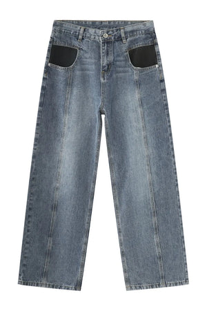 Panel seam denim trousers in medium wash with black pocket details and wide leg.