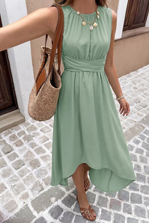 Sage green sleeveless high-low a-line dress with ruched waist detail and round neckline.