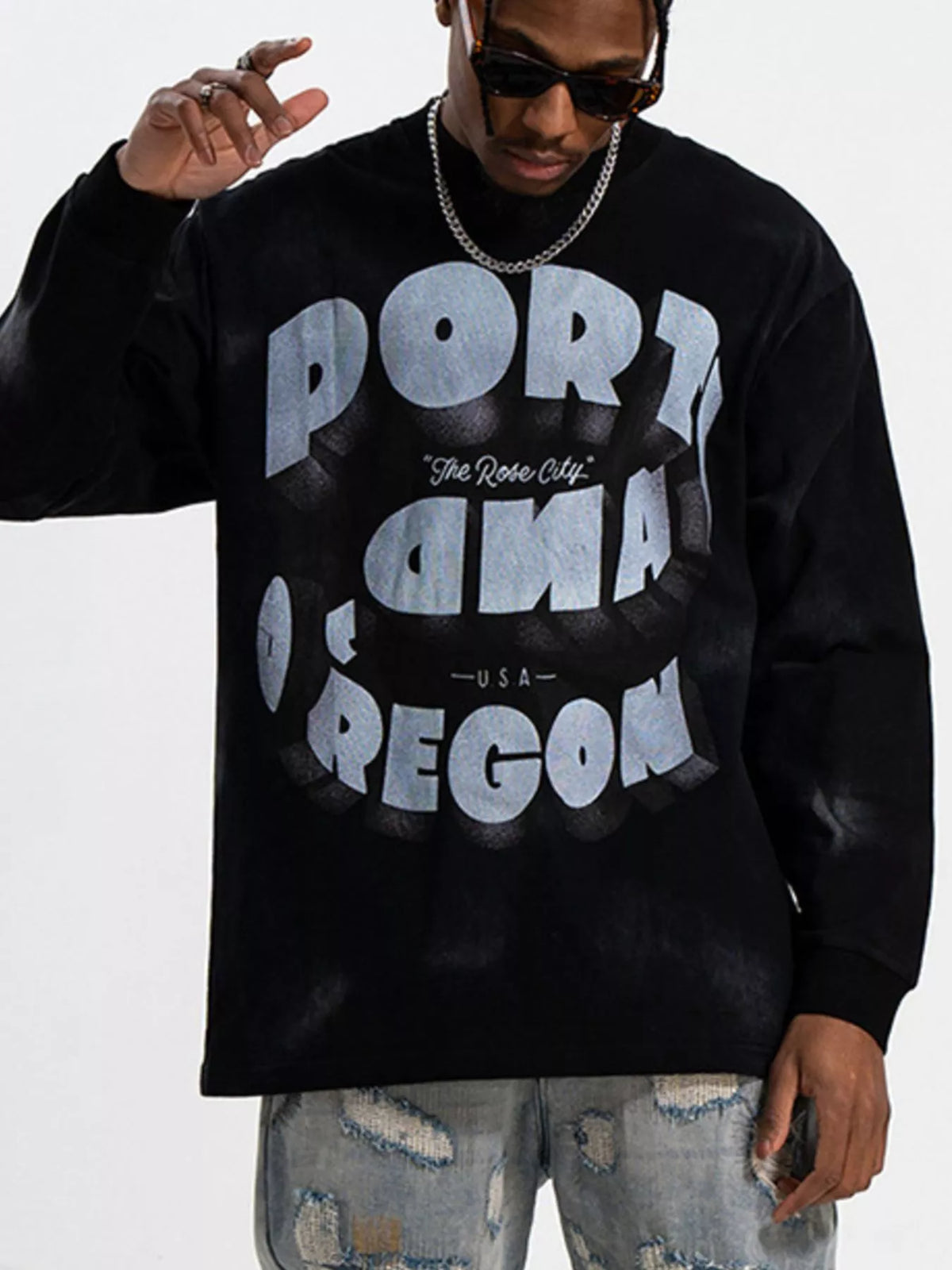 Black oversized long-sleeve tee with "PORTLAND OREGON The Rose City USA" graphic print.