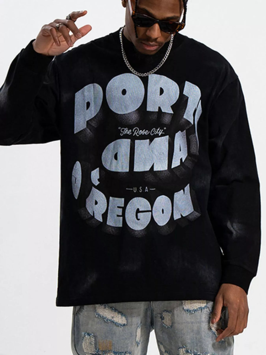 Black oversized long-sleeve tee with "PORTLAND OREGON The Rose City USA" graphic print.