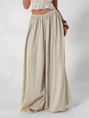 Textured beige cotton maternity pants with wide legs and gathered waist