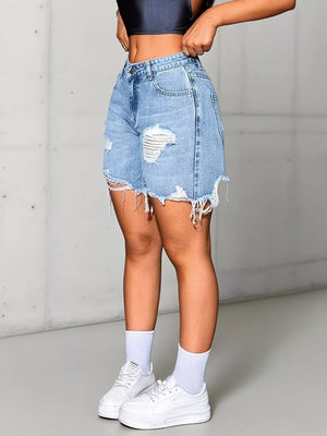 Light wash denim shorts with high waist, distressed rips, and frayed hem.