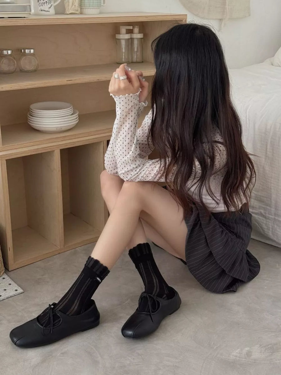 Black socks featuring sheer and geometric