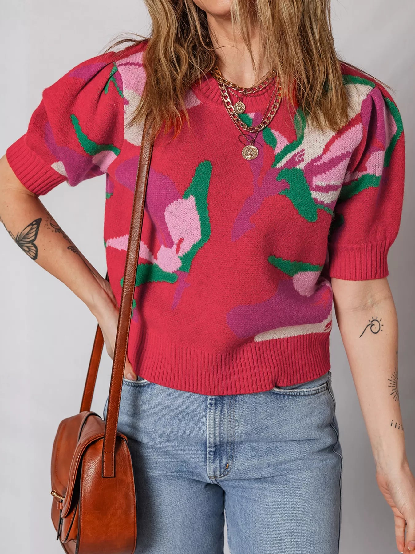 Abstract floral puff sleeve sweater in scarlet with a crew neck and short sleeves.