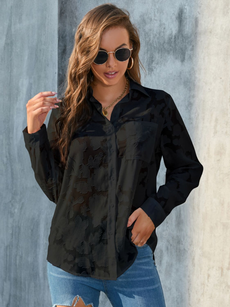 Black sheer button-down blouse with floral embroidery and a collared neckline.