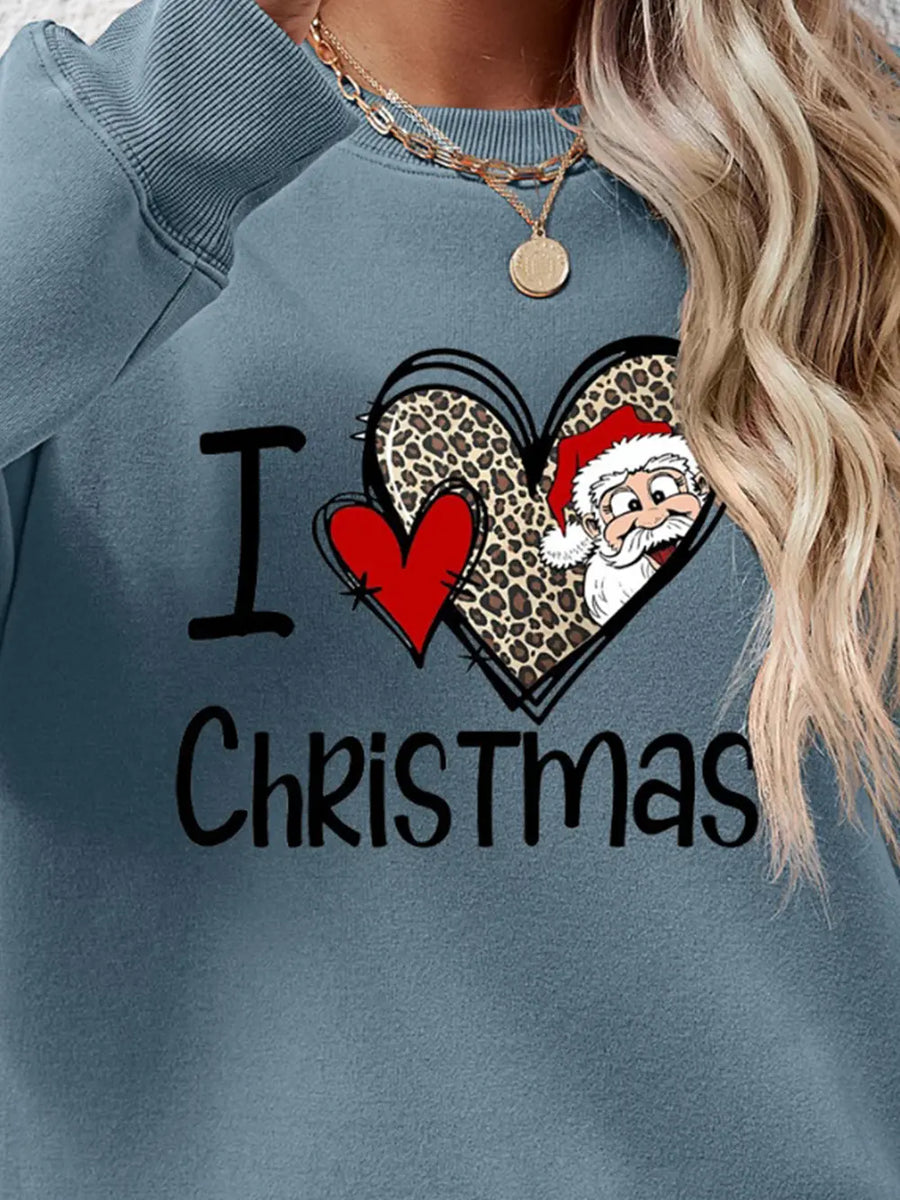 Light blue crewneck sweatshirt with "I Love Christmas" graphic featuring Santa and leopard print heart.