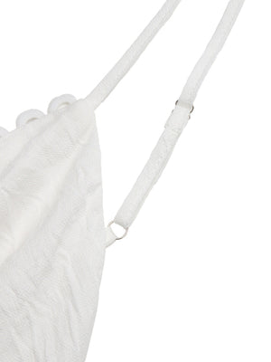 White lace tiered maxi dress with adjustable spaghetti straps and scalloped trim detail.
